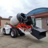 Mobile self loading concrete mixer