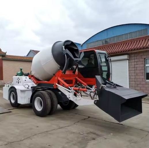 Mobile self loading concrete mixer